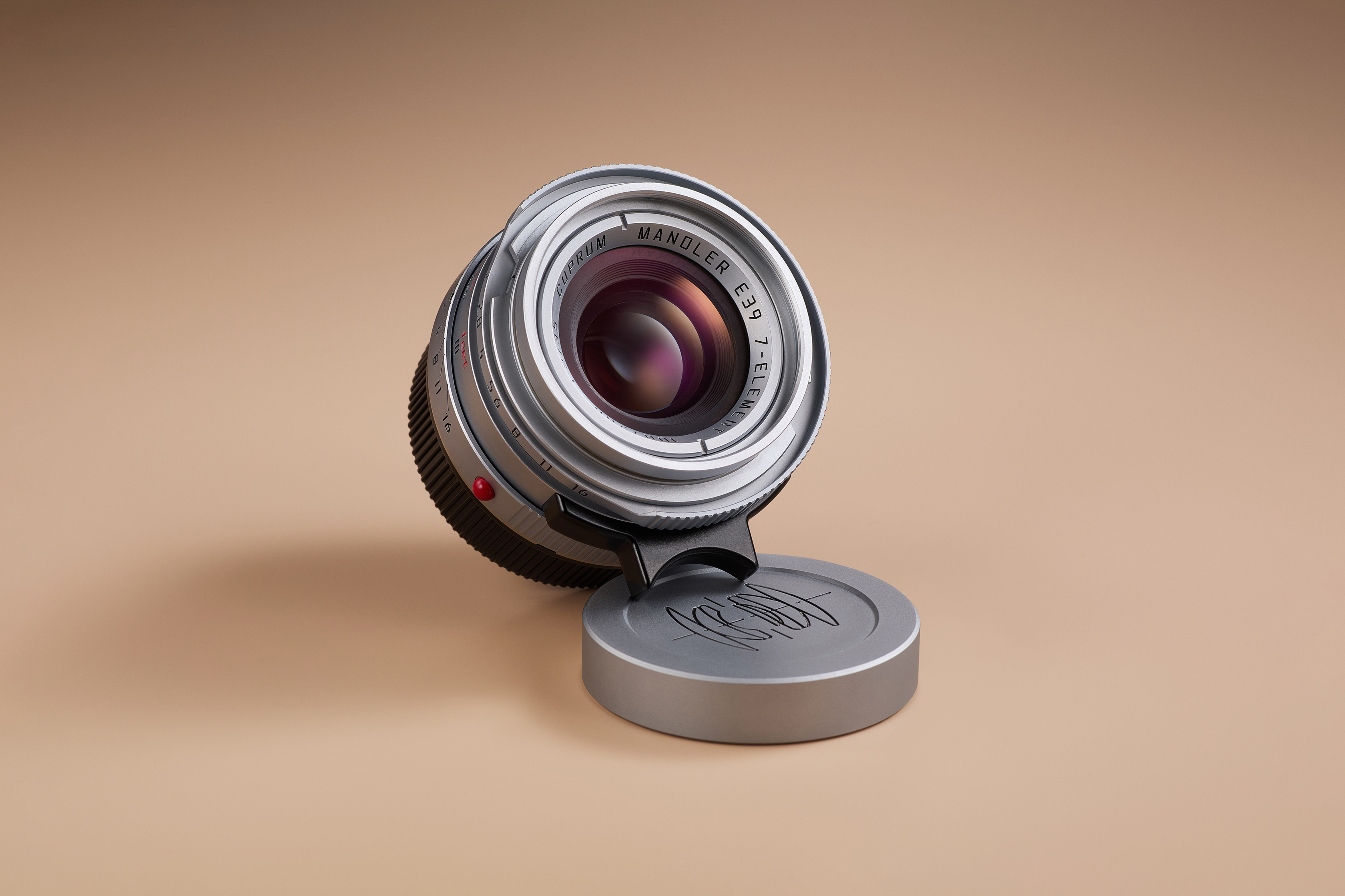 Mandler 35mm f2 lens (chrome planted brass) with its cap 