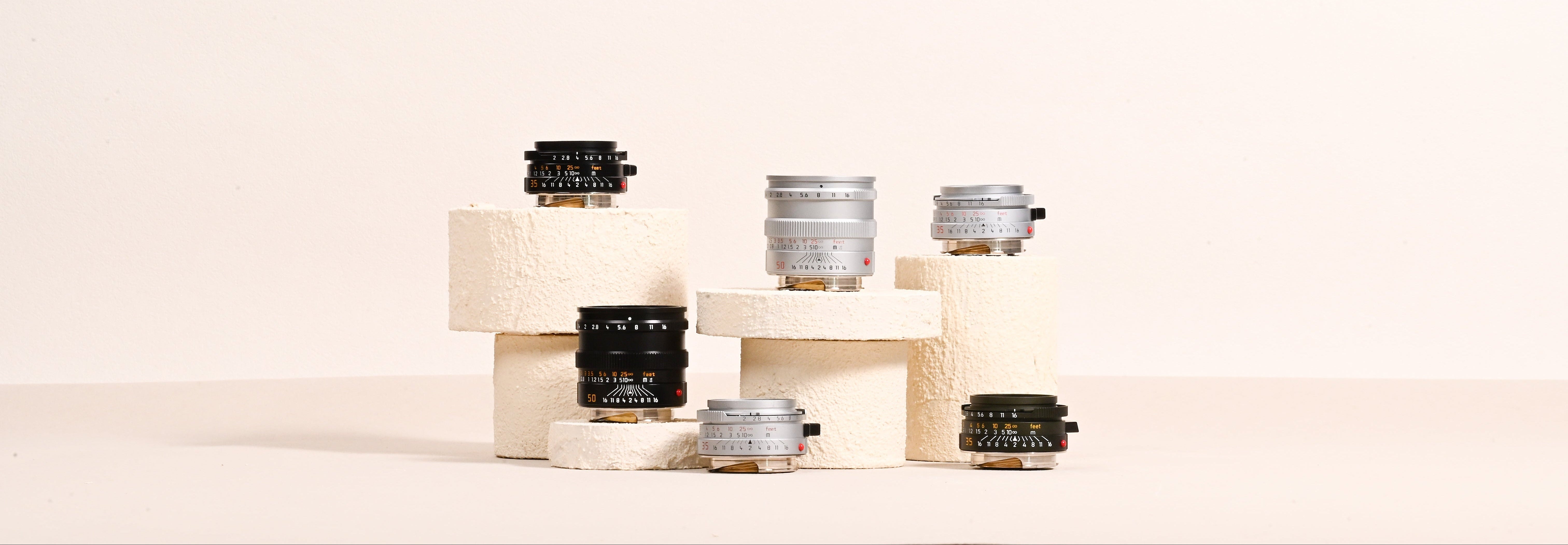 Mandler 35mm and 50mm manual-focus lenses in black and silver finishes
